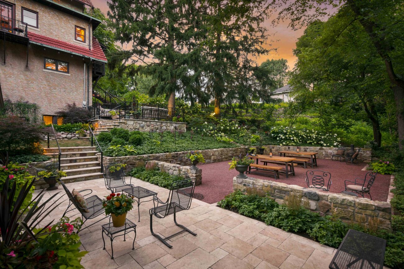 Terraced stone steps, boulder retaining wall and perennial beds in a Naperville, IL landscape renovation